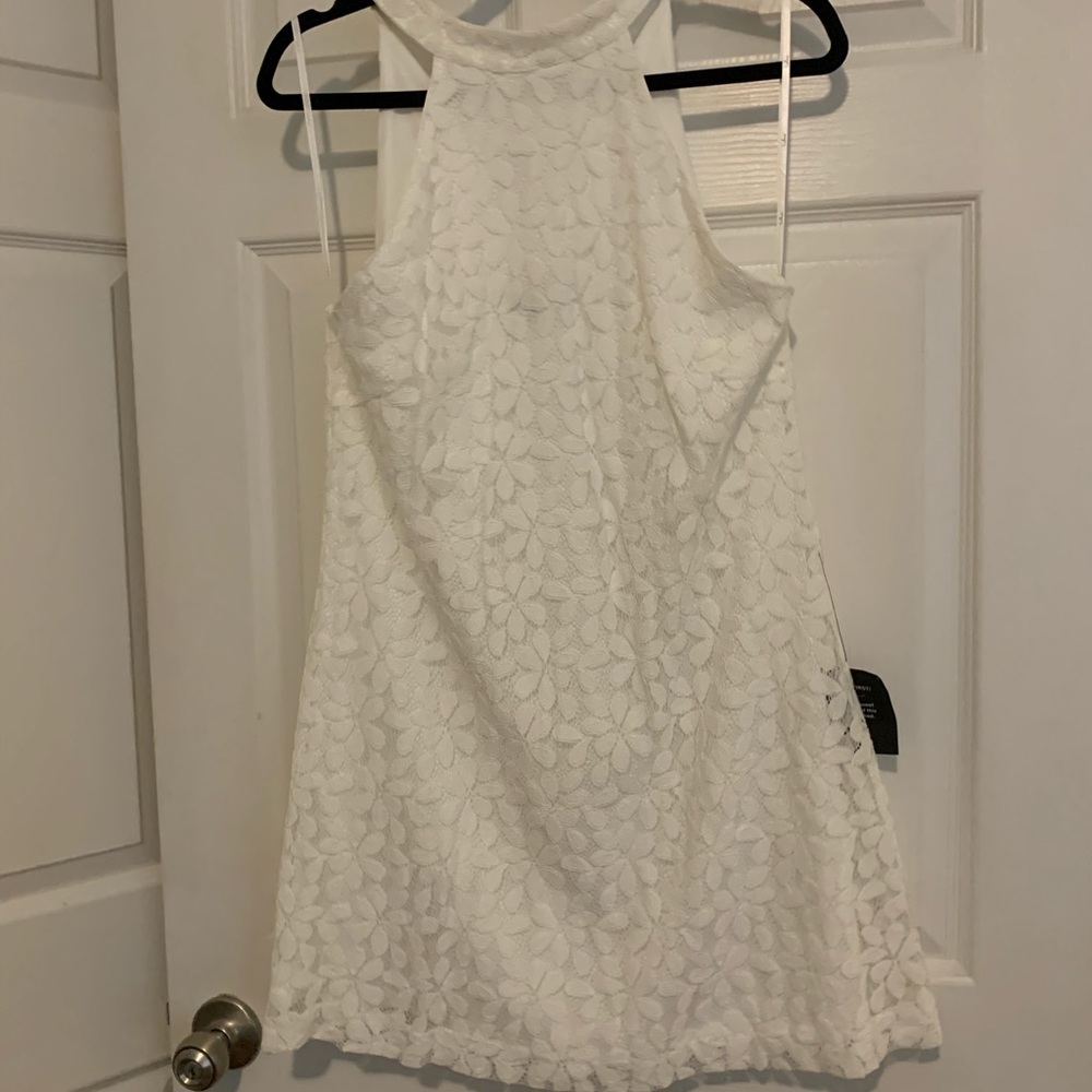 New with tags. Never worn. Size M. White floral dress from LuLus.